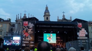 The acoustics in Piazza San Carlo aren't even that good, but the two churches and dramatic summer skies make a good background for the stage.